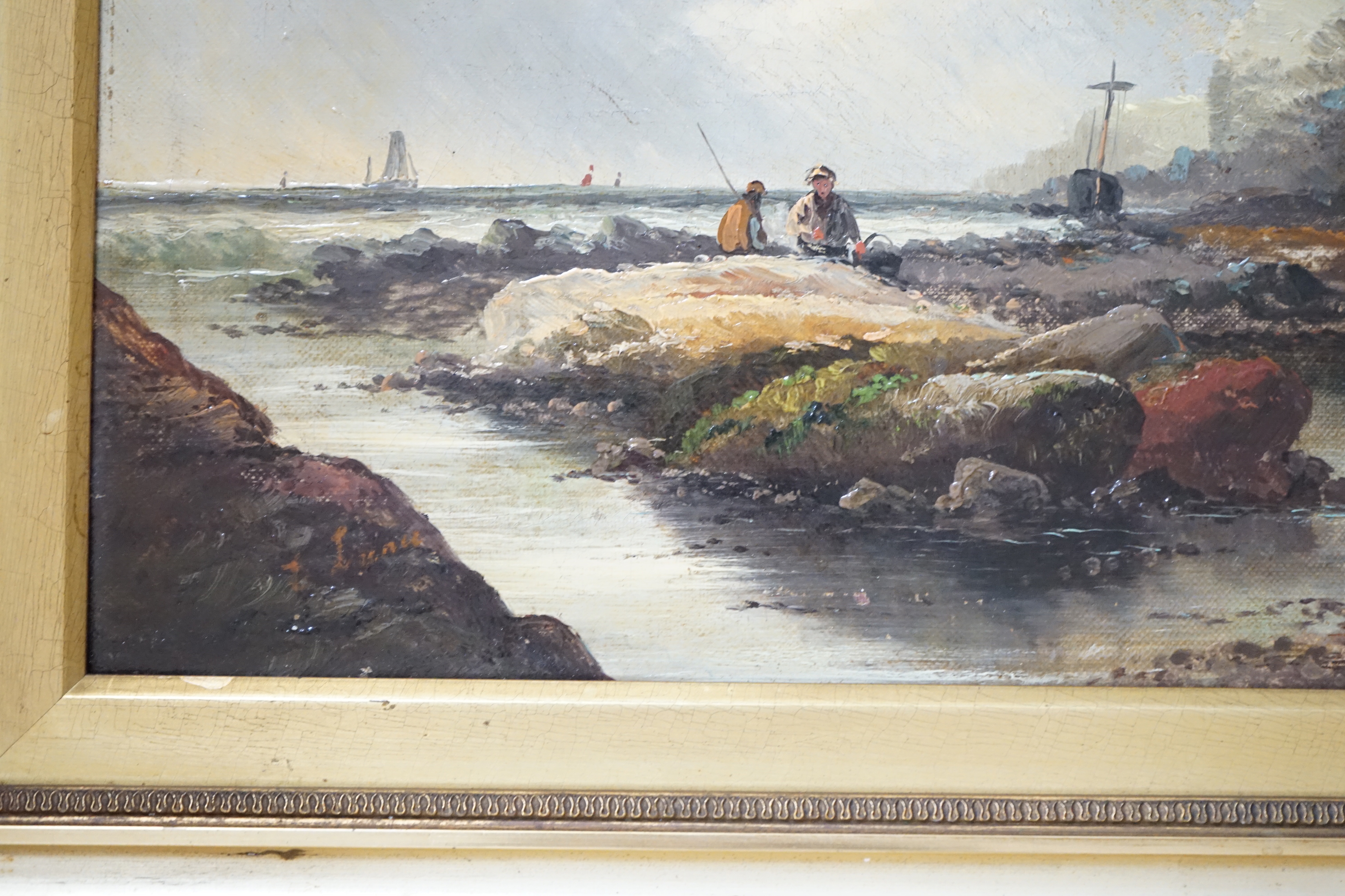 Late 19th/early 20th century school, oil on canvas, Coastal scene with figures collecting shellfish, unsigned, 29 x 44cm